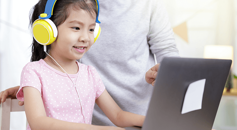 Child and parent looking at laptop computer